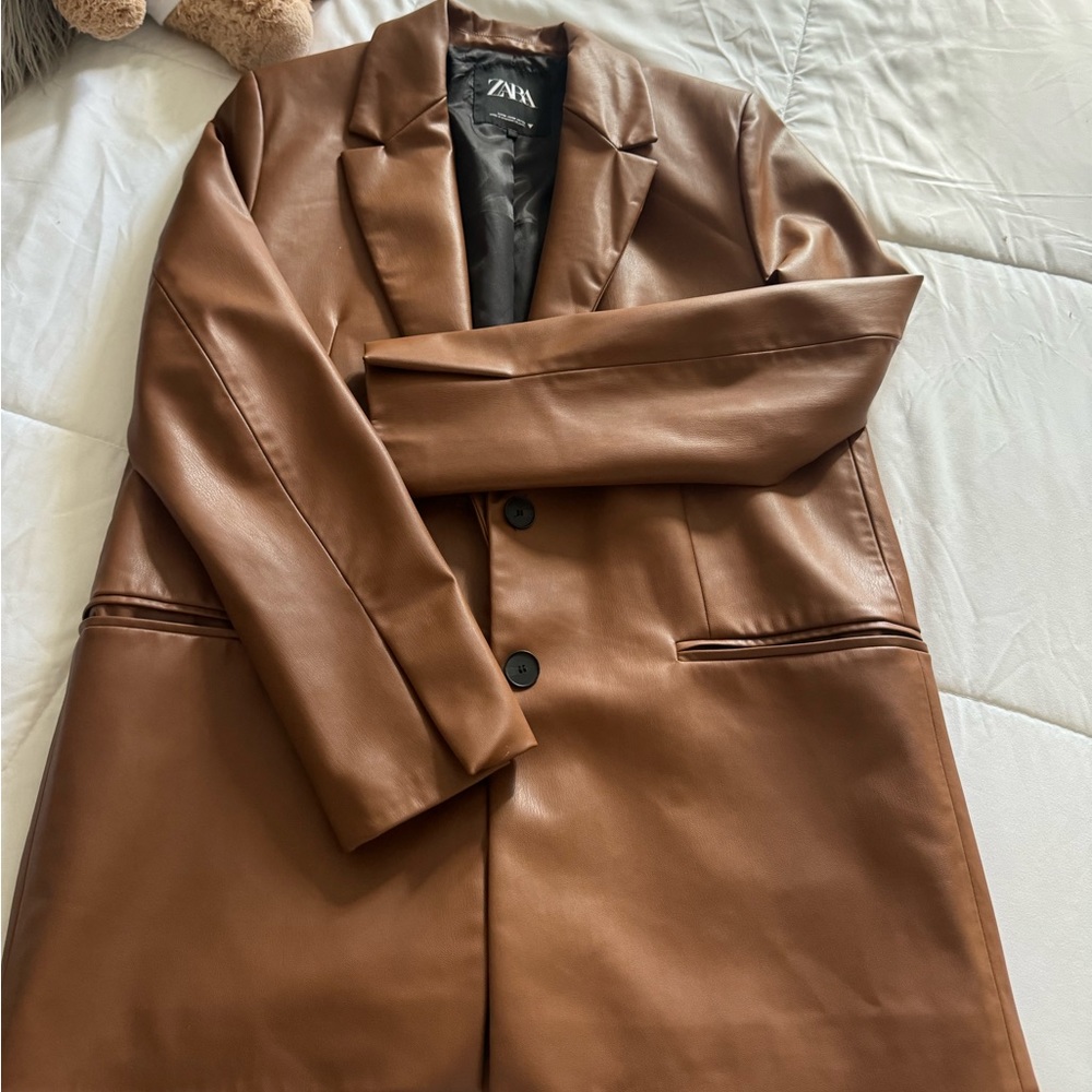 Beautiful faux leather coat from Zara. Brand new with no tags
